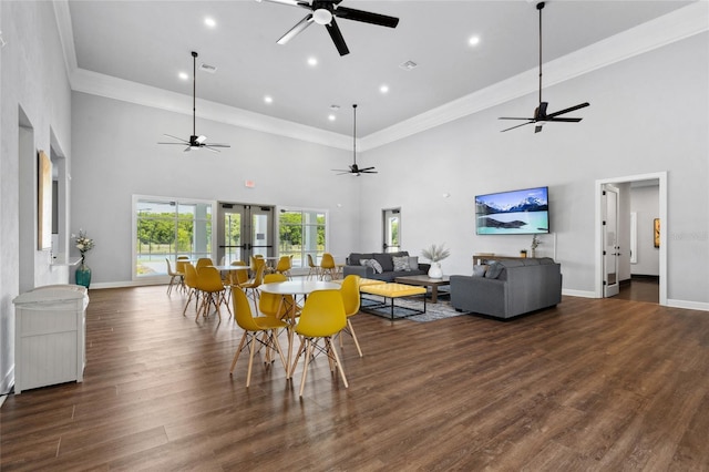 dining area with french doors, wood finished floors, visible vents, and baseboards