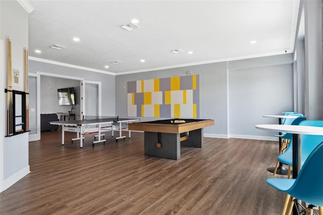 playroom featuring ornamental molding, wood finished floors, visible vents, and baseboards