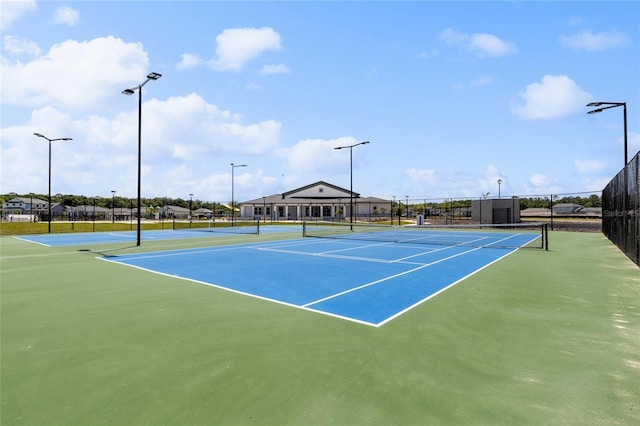 view of tennis court with fence