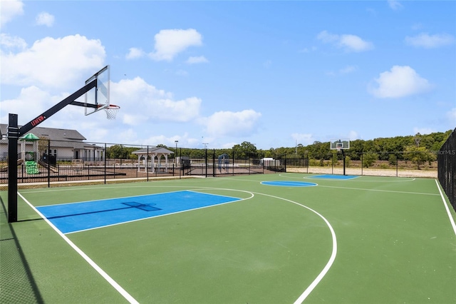 view of sport court featuring community basketball court and fence