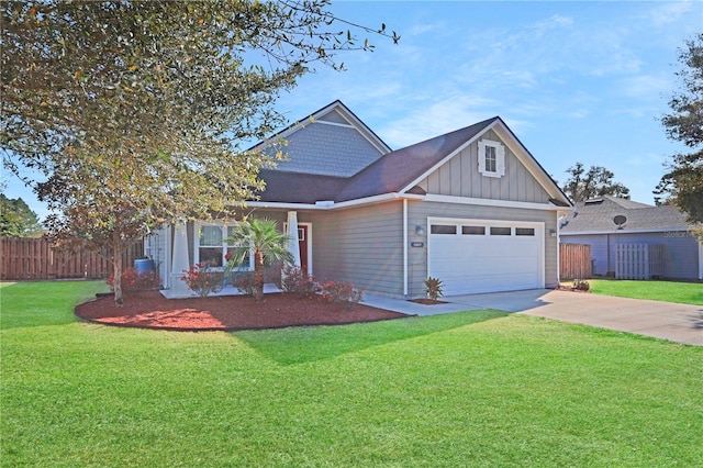 view of front facade featuring concrete driveway, fence, board and batten siding, and a front yard