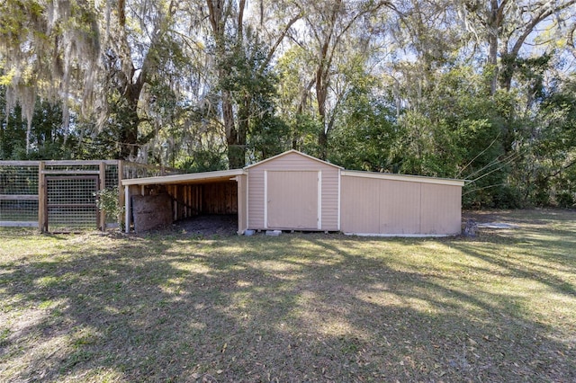 view of shed with fence