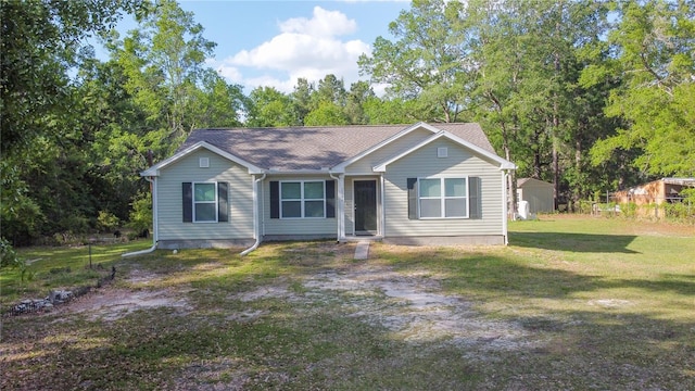 2306 NW 121st Ave, Gainesville, FL 32609 - view of front facade featuring a front lawn