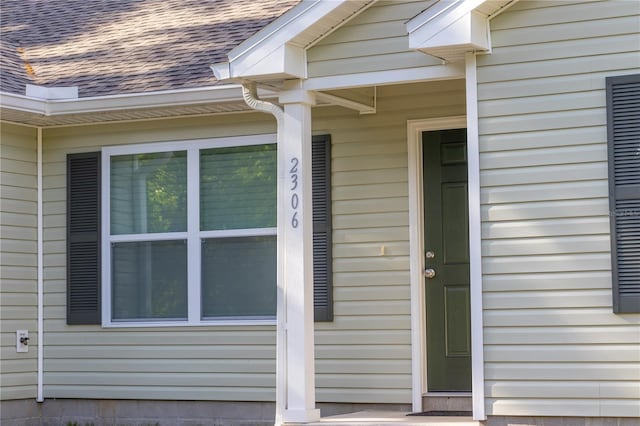 2306 NW 121st Ave, Gainesville, FL 32609 - view of exterior entry featuring a shingled roof