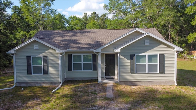 2306 NW 121st Ave, Gainesville, FL 32609 - view of front facade featuring a front lawn and a shingled roof