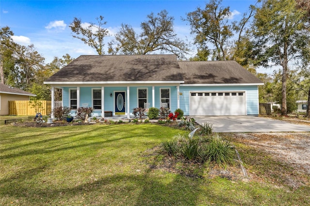 view of front of home with a porch, an attached garage, a front yard, fence, and driveway