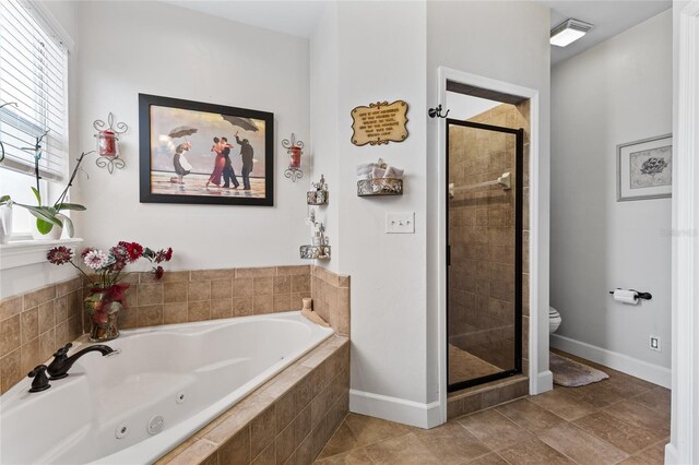 bathroom with toilet, visible vents, baseboards, a jetted tub, and a stall shower