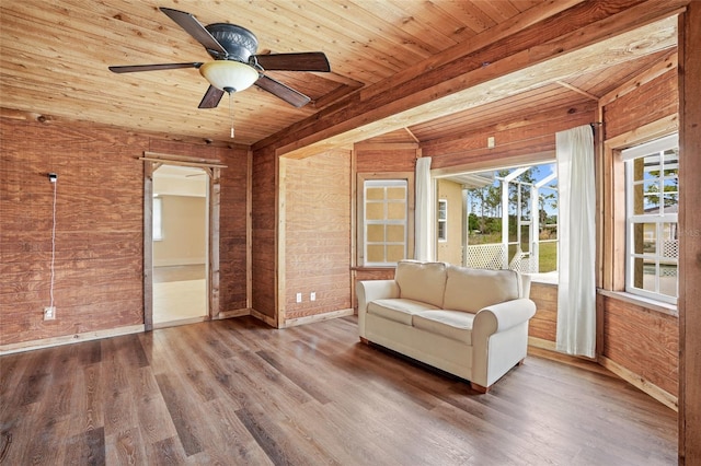 unfurnished room featuring ceiling fan, wooden ceiling, wood finished floors, and baseboards