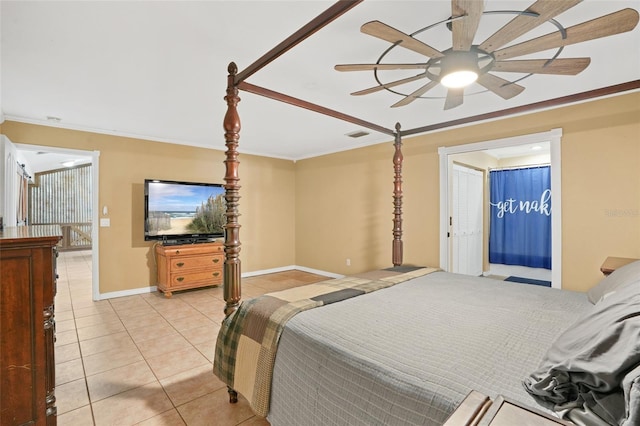 bedroom with light tile patterned floors, visible vents, baseboards, a ceiling fan, and crown molding