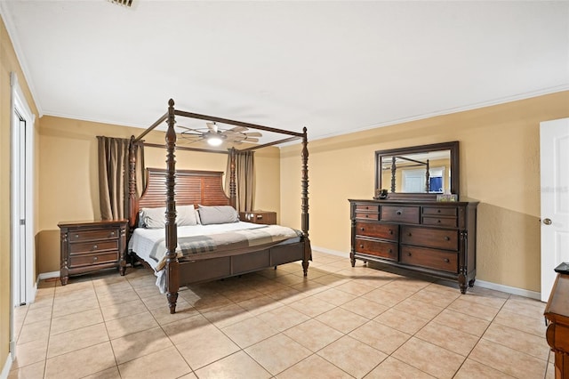 bedroom with ceiling fan, crown molding, baseboards, and light tile patterned floors