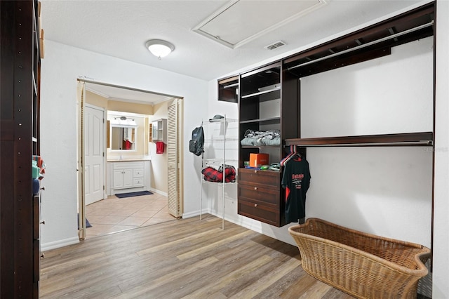 spacious closet with wood finished floors and visible vents