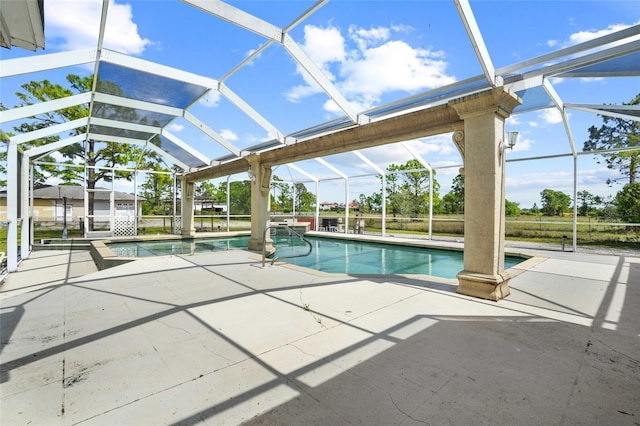 outdoor pool featuring a lanai and a patio area