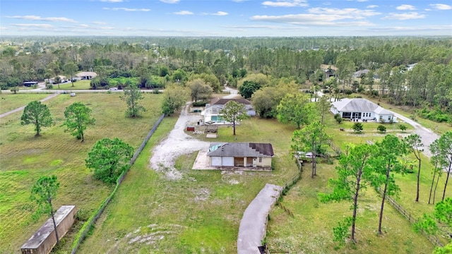 drone / aerial view featuring a view of trees