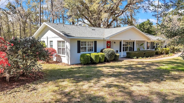 single story home featuring covered porch, a front lawn, and stucco siding