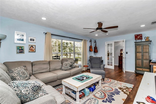 living room with visible vents, baseboards, recessed lighting, a ceiling fan, and dark wood-style flooring