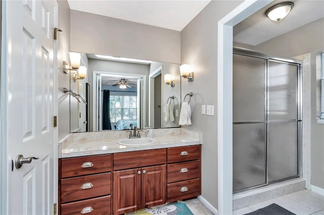 ensuite bathroom featuring vanity, a shower stall, ensuite bathroom, and ceiling fan