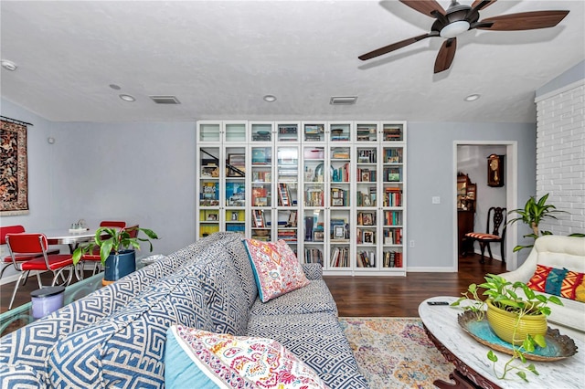 living room with visible vents, baseboards, recessed lighting, wood finished floors, and a ceiling fan