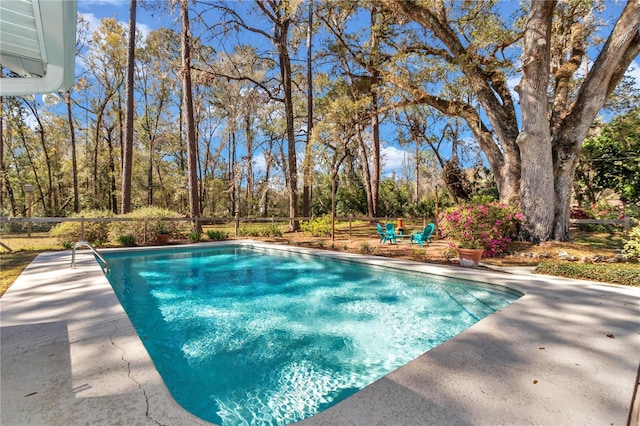 outdoor pool featuring a patio