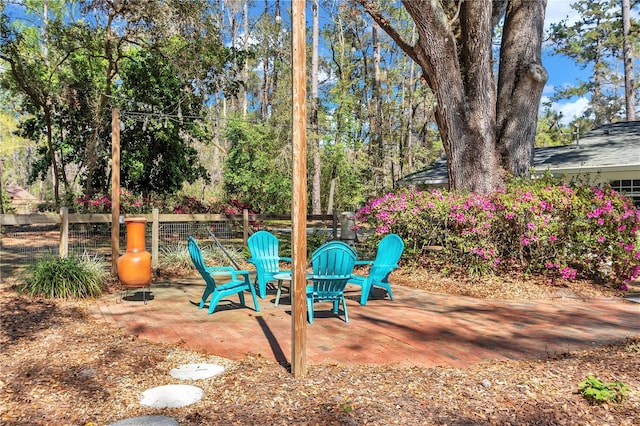 view of yard featuring a patio and fence