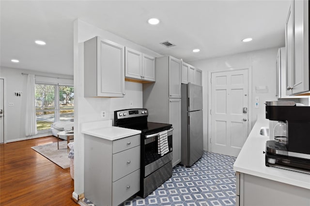 kitchen with visible vents, recessed lighting, appliances with stainless steel finishes, and light countertops