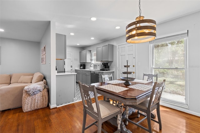 dining room featuring recessed lighting, baseboards, and wood finished floors