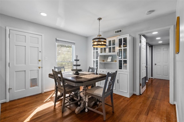 dining room featuring dark wood finished floors, recessed lighting, visible vents, and baseboards