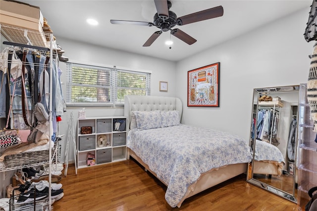 bedroom with recessed lighting, ceiling fan, and wood finished floors