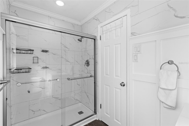 full bathroom featuring a marble finish shower and crown molding