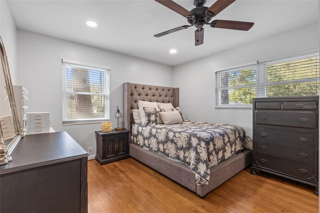 bedroom featuring recessed lighting, light wood-type flooring, baseboards, and a ceiling fan