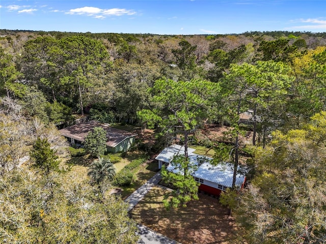 birds eye view of property with a forest view