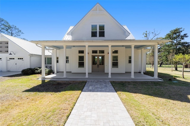 view of front facade featuring french doors and a front lawn