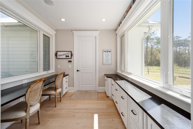 office area featuring recessed lighting, baseboards, and light wood-style flooring