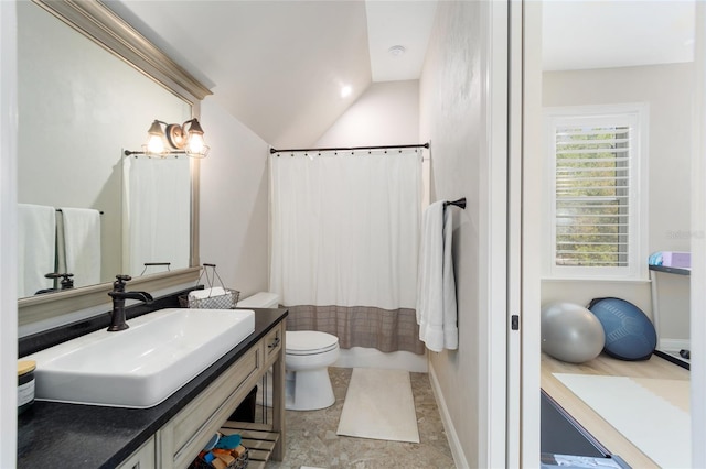 full bath with curtained shower, toilet, vanity, and vaulted ceiling