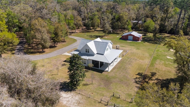 bird's eye view featuring a forest view