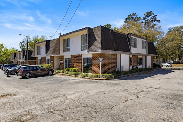 view of property with uncovered parking