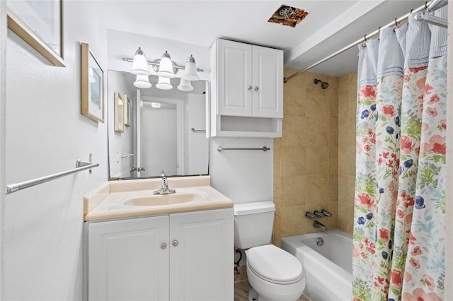 full bathroom with toilet, vanity, and shower / bath combo