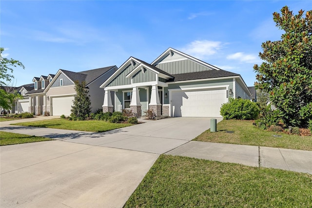 craftsman house with a front lawn, a garage, board and batten siding, and driveway