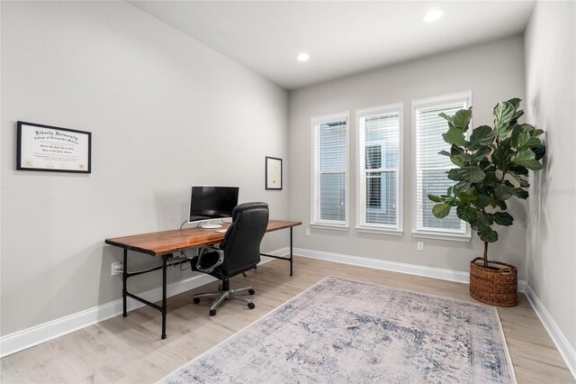 office area with recessed lighting, baseboards, and light wood-style floors