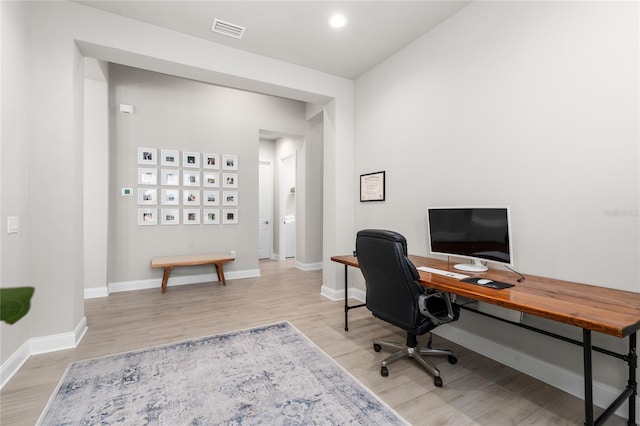 office area featuring light wood-type flooring, visible vents, baseboards, and recessed lighting