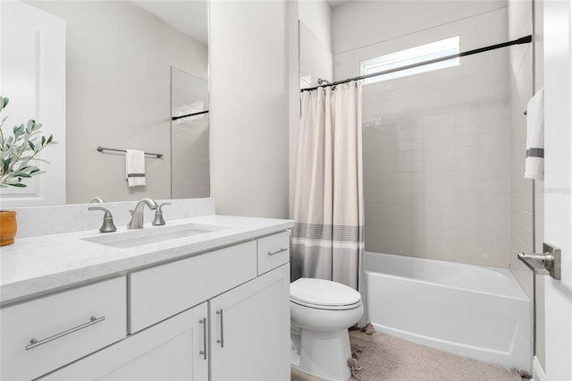 bathroom with vanity, shower / tub combo, and toilet