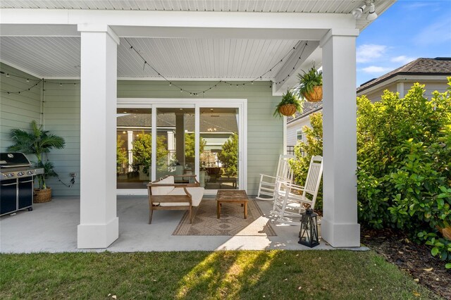 view of patio featuring a grill