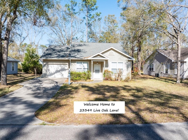 ranch-style home with a garage, a front yard, driveway, and a shingled roof