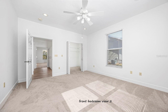 unfurnished bedroom featuring a ceiling fan, baseboards, recessed lighting, a closet, and light carpet