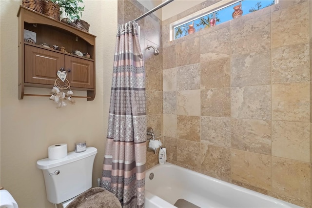 bathroom with toilet and shower / bath combo