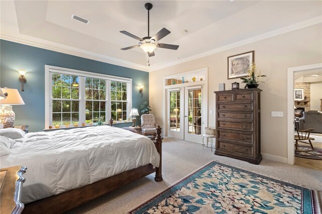 carpeted bedroom featuring visible vents, access to outside, ornamental molding, and french doors