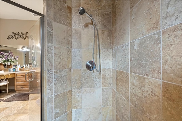 interior details featuring a stall shower and vanity