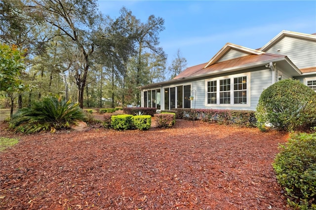 back of property featuring a sunroom