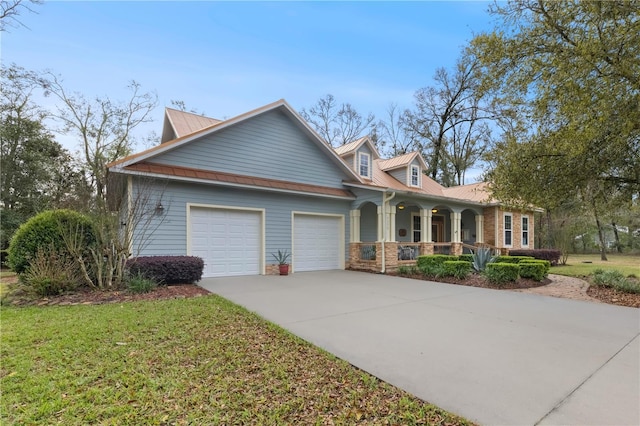 view of front of property with a front lawn, stone siding, a porch, concrete driveway, and an attached garage