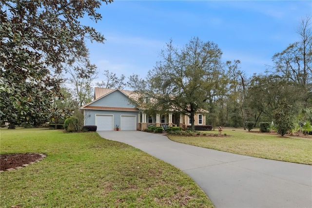 view of front of property with a garage, driveway, and a front yard