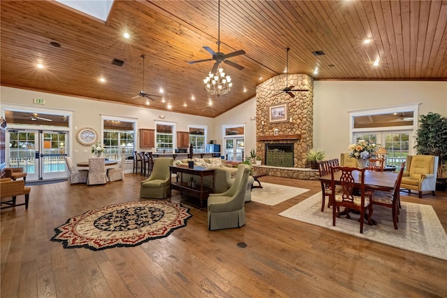 living room with high vaulted ceiling, a ceiling fan, hardwood / wood-style flooring, a fireplace, and wood ceiling